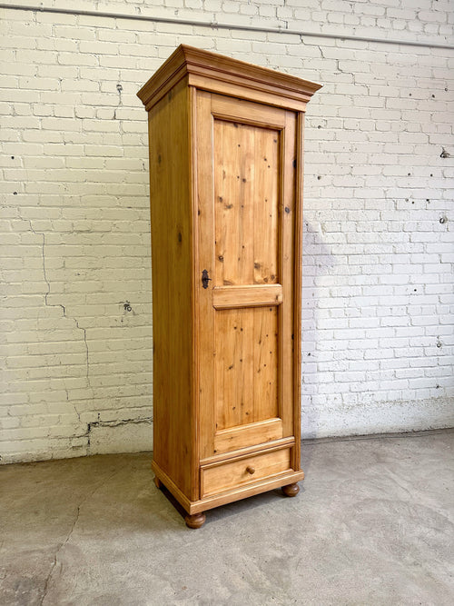 A Tall and Narrow Antique Pine European Cupboard with Bottom Drawer c. 1900