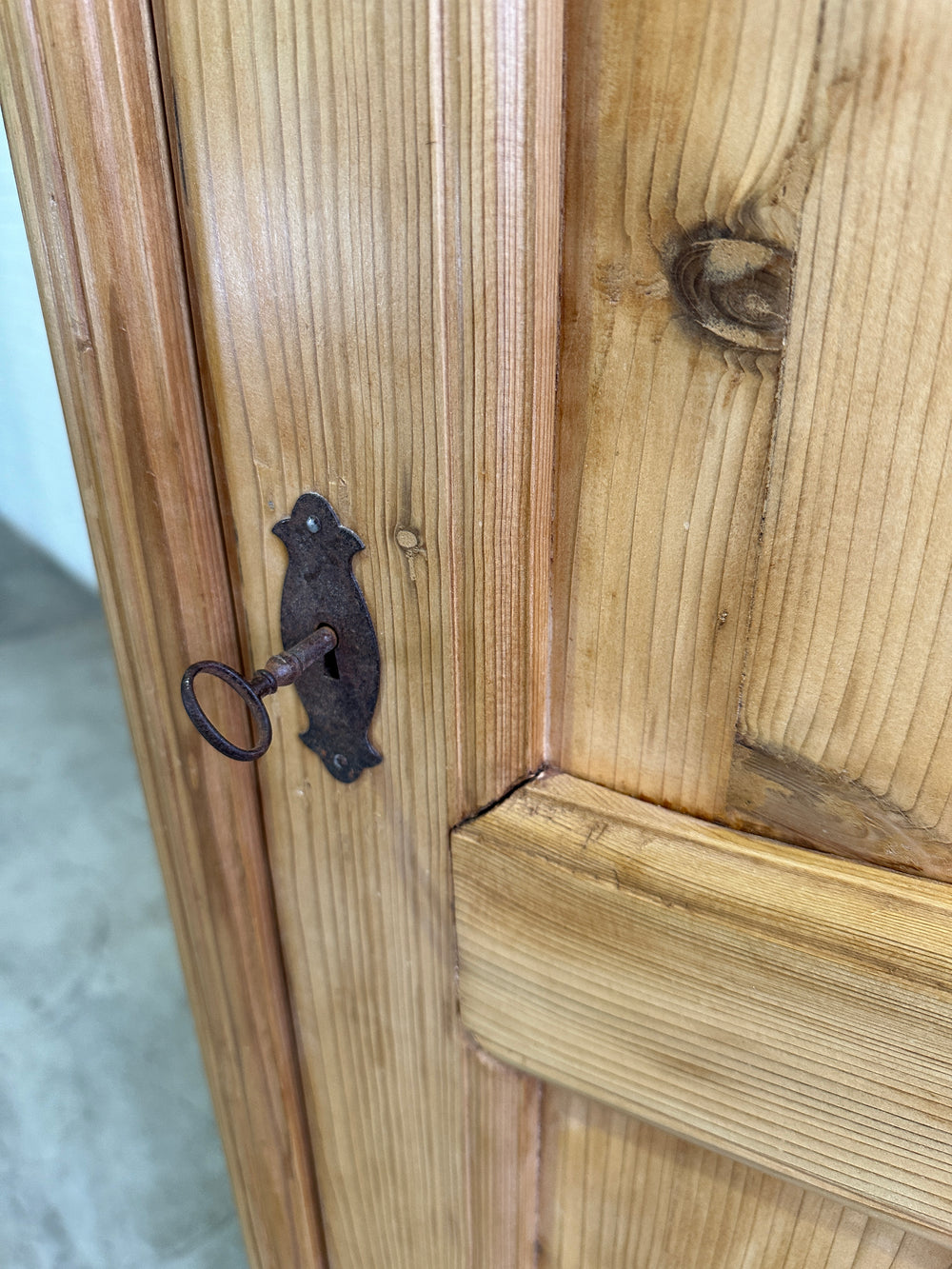 A Tall and Narrow Antique Pine European Cupboard with Bottom Drawer c. 1900