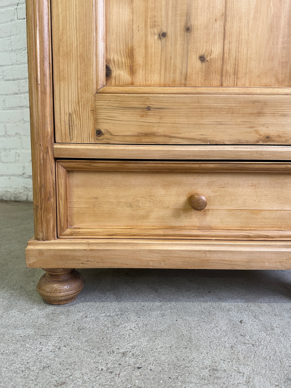 A Tall and Narrow Antique Pine European Cupboard with Bottom Drawer c. 1900
