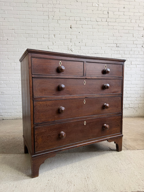 An Antique Oak English Chest of Drawers on Bracket Feet c. 1820