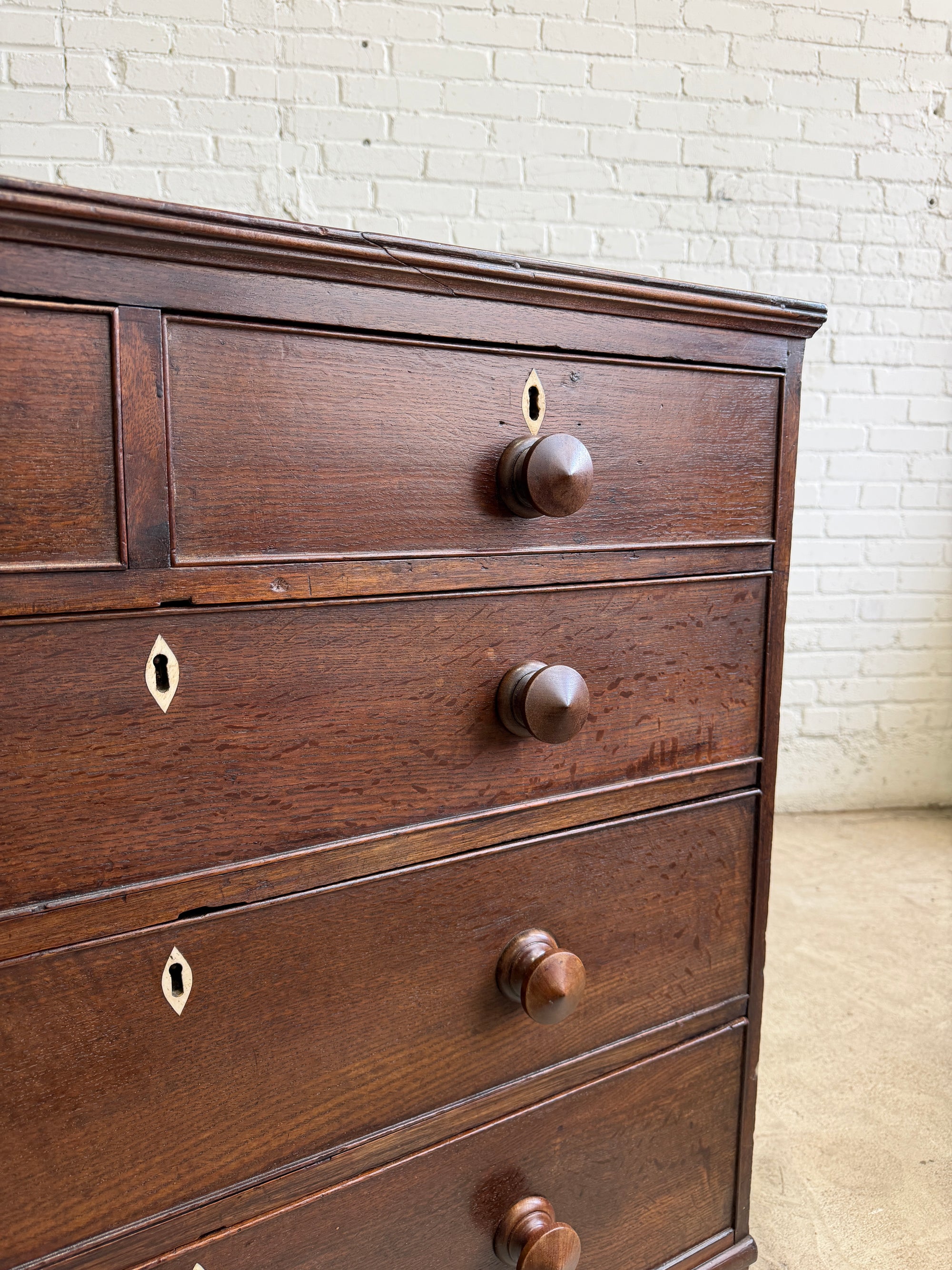 An Antique Oak English Chest of Drawers on Bracket Feet c. 1820