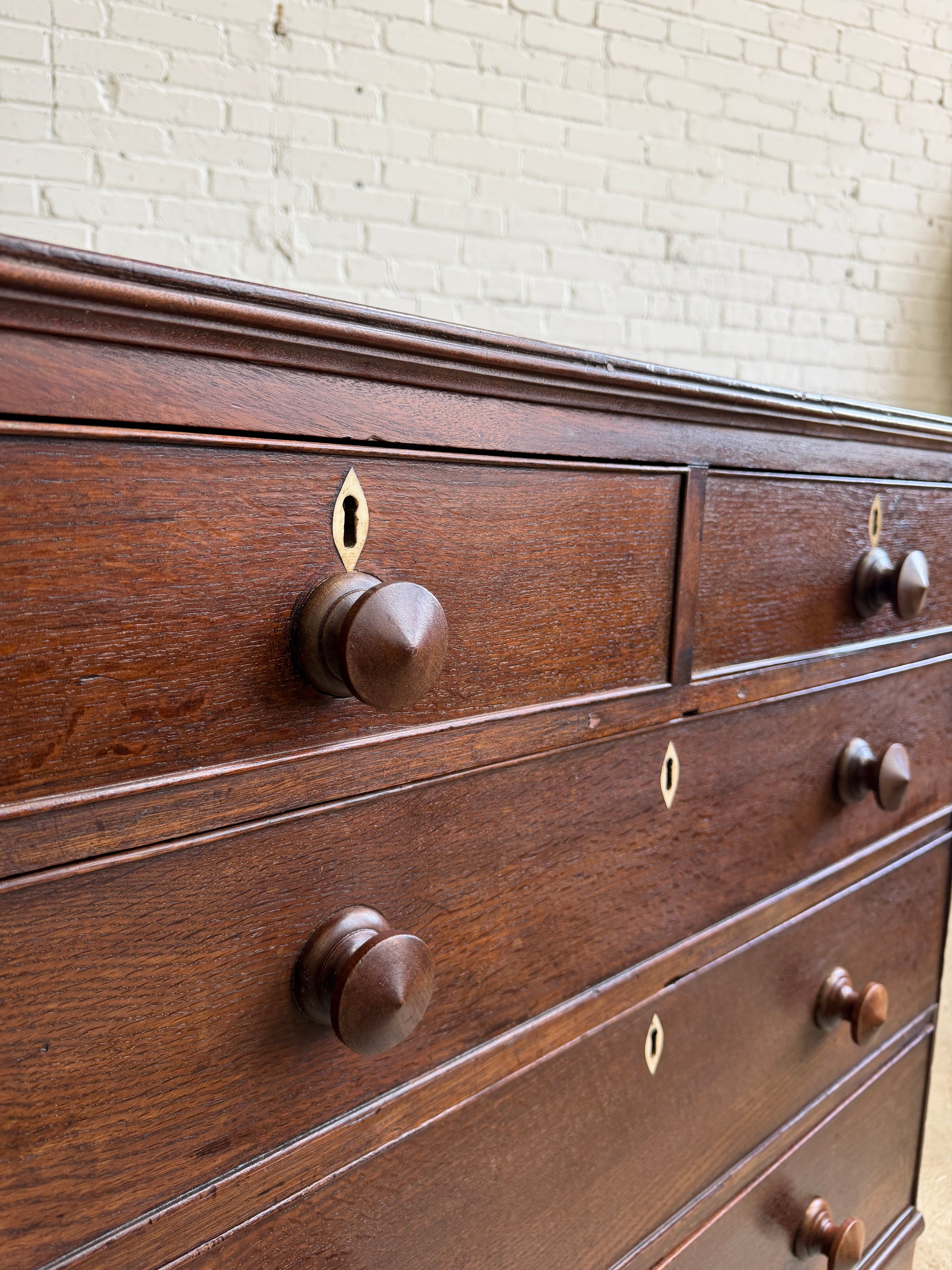 An Antique Oak English Chest of Drawers on Bracket Feet c. 1820