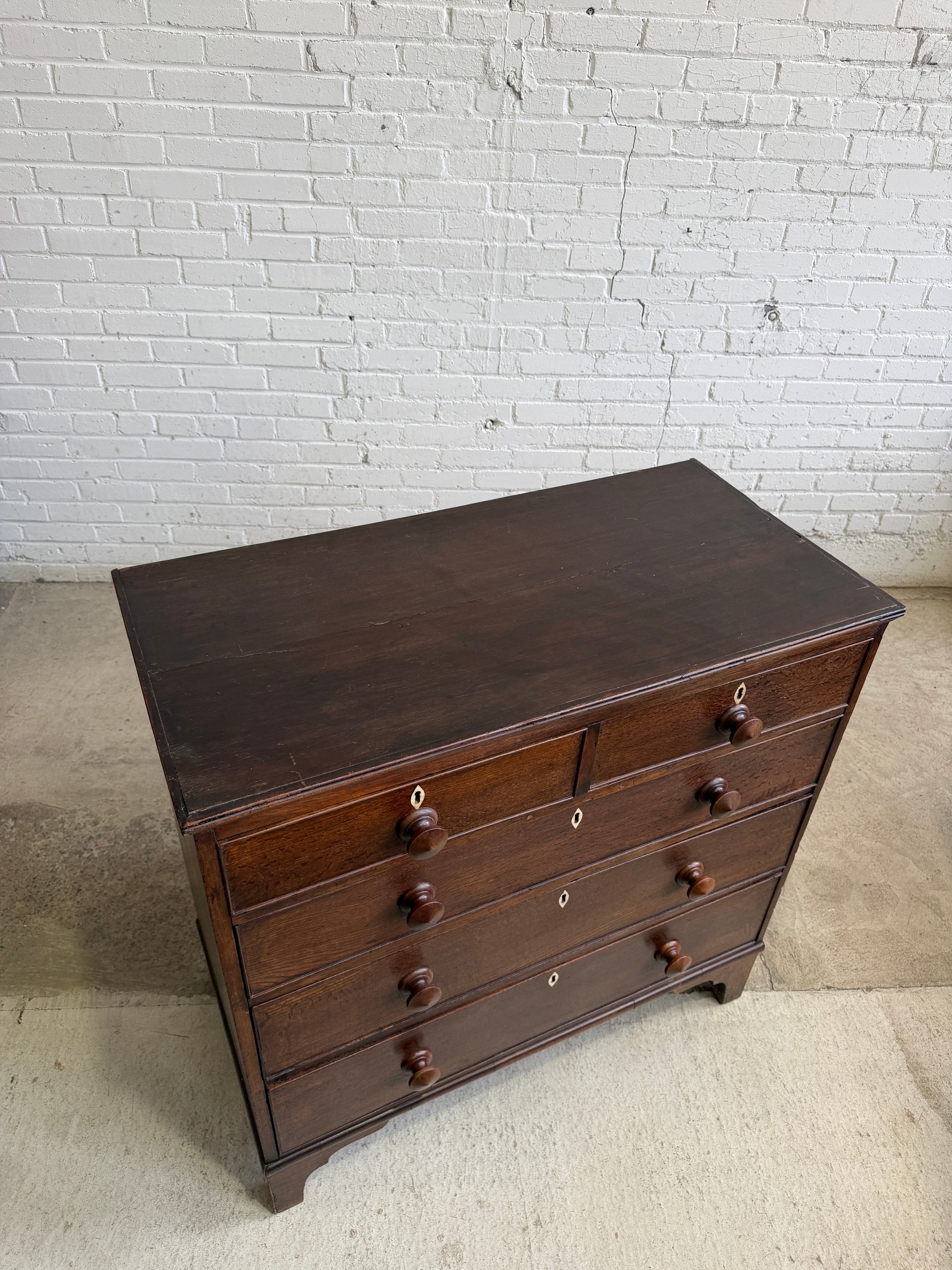 An Antique Oak English Chest of Drawers on Bracket Feet c. 1820