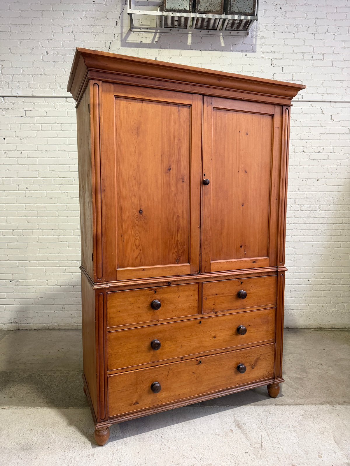 A Large English Antique Pine Linen Press with Mahogany Knobs, c. 1880