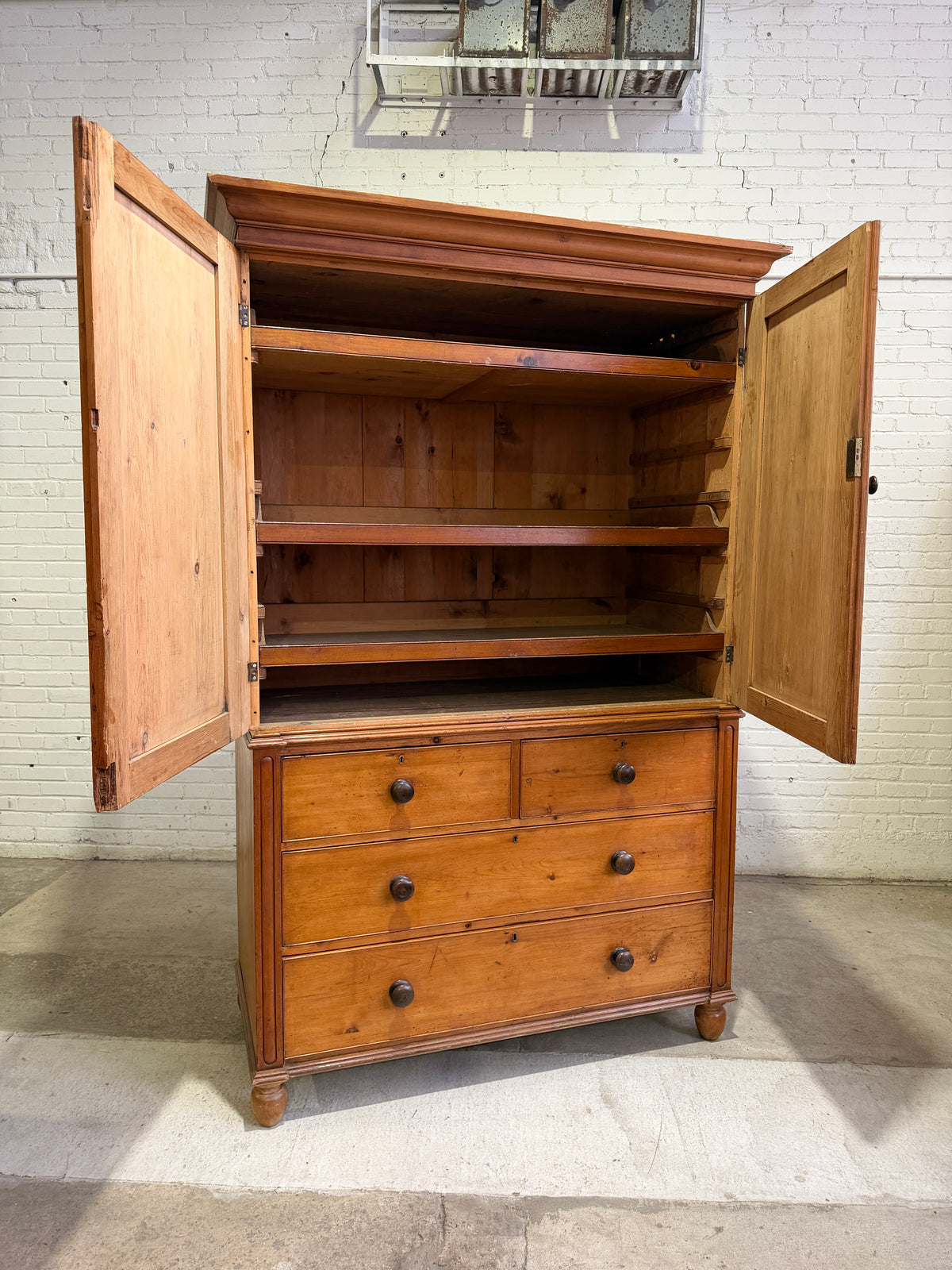 A Large English Antique Pine Linen Press with Mahogany Knobs, c. 1880