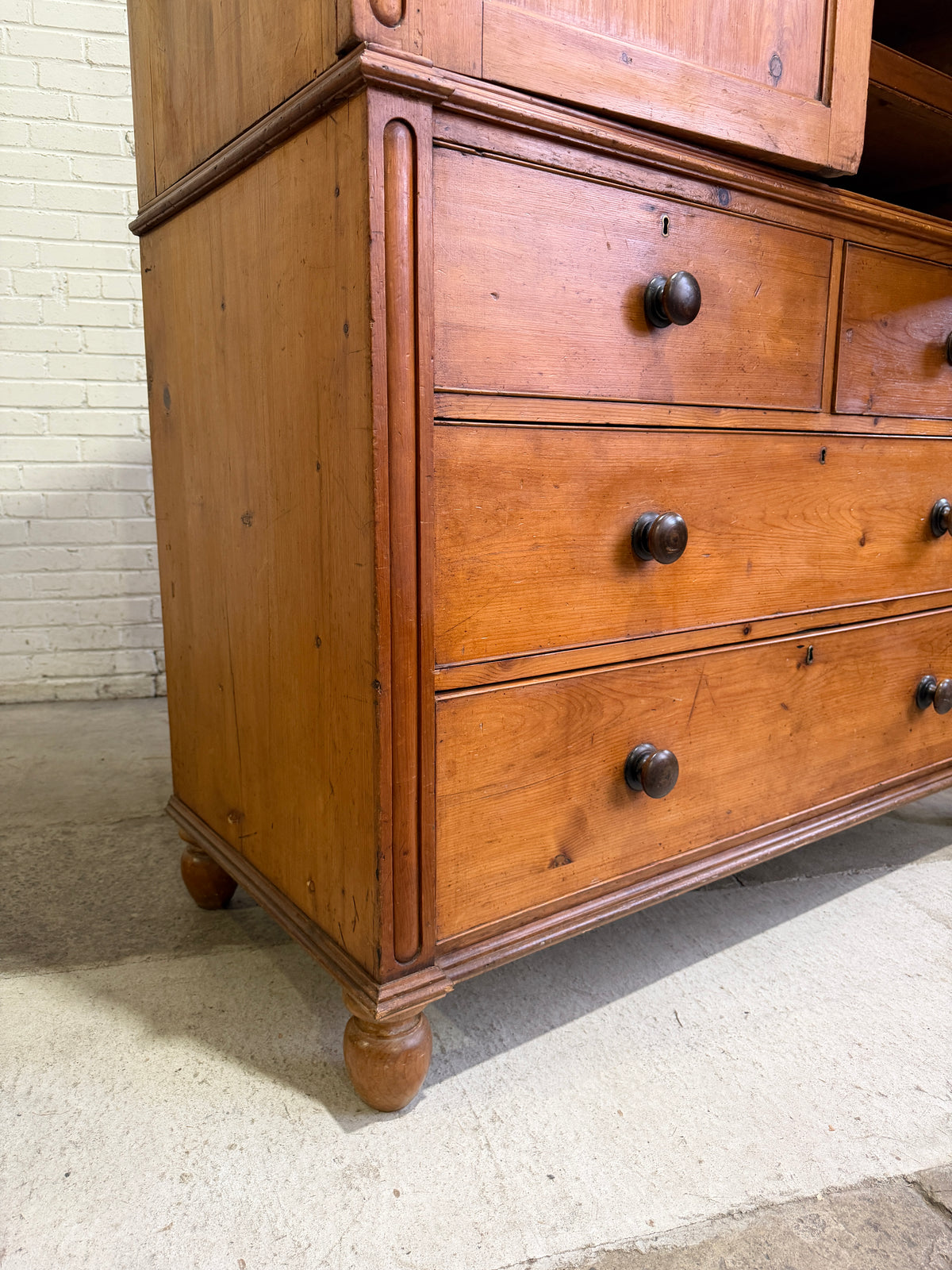 A Large English Antique Pine Linen Press with Mahogany Knobs, c. 1880