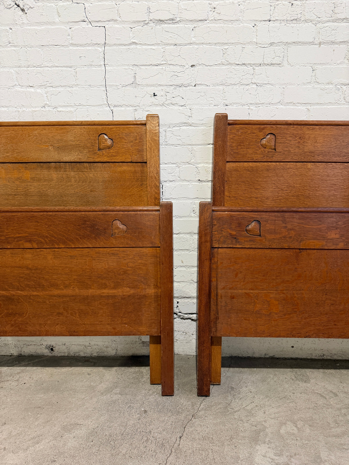 A Pair of Edwardian Heart Motif Beds by Liberty of London