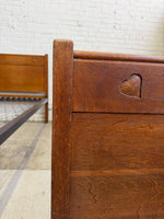 A Pair of Edwardian Heart Motif Beds by Liberty of London