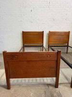 A Pair of Edwardian Heart Motif Beds by Liberty of London