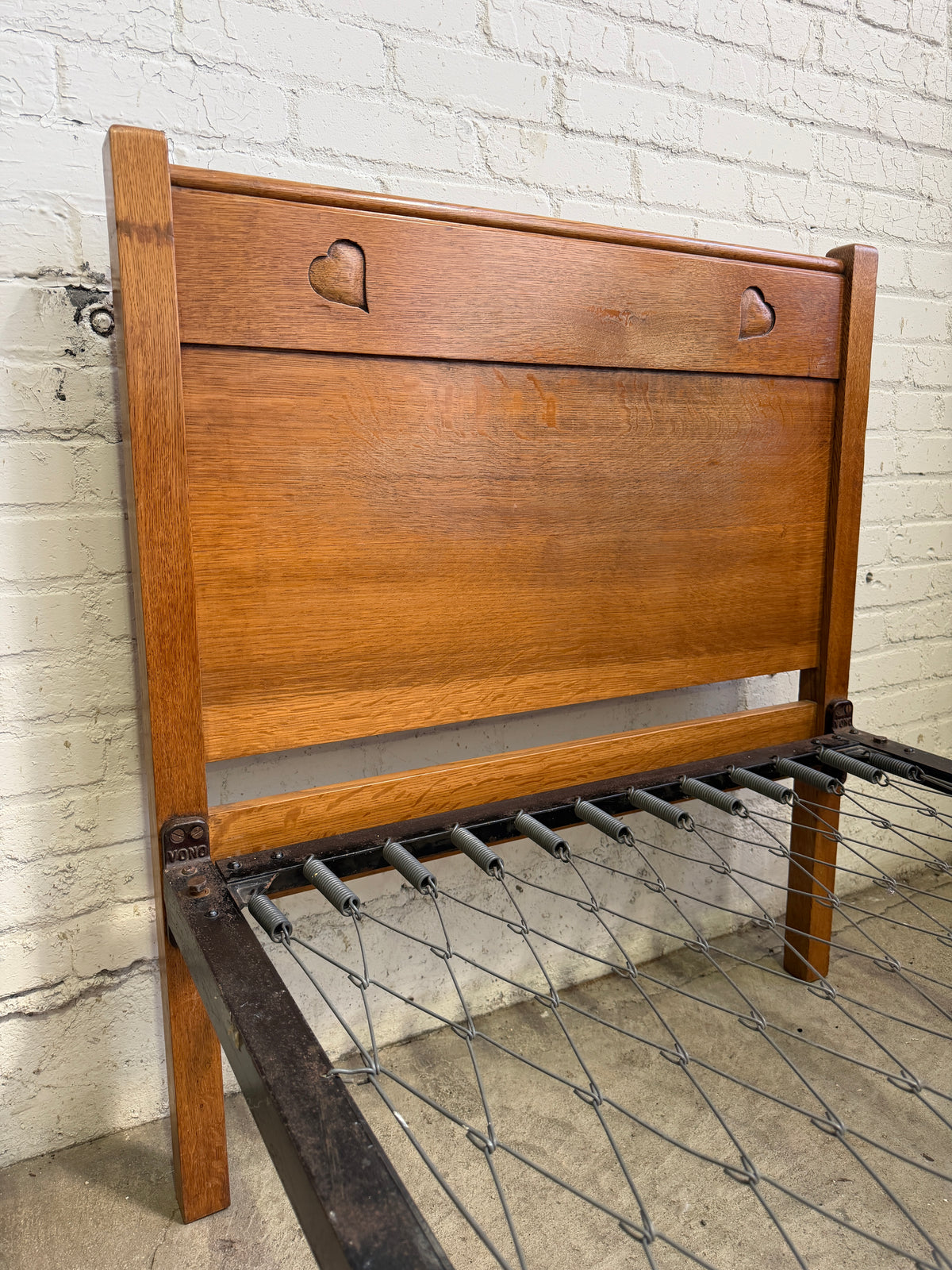 A Pair of Edwardian Heart Motif Beds by Liberty of London