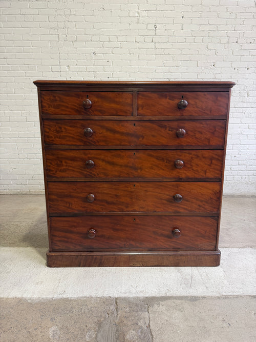 An Antique English Flame Mahogany Chest of Drawers c.1860