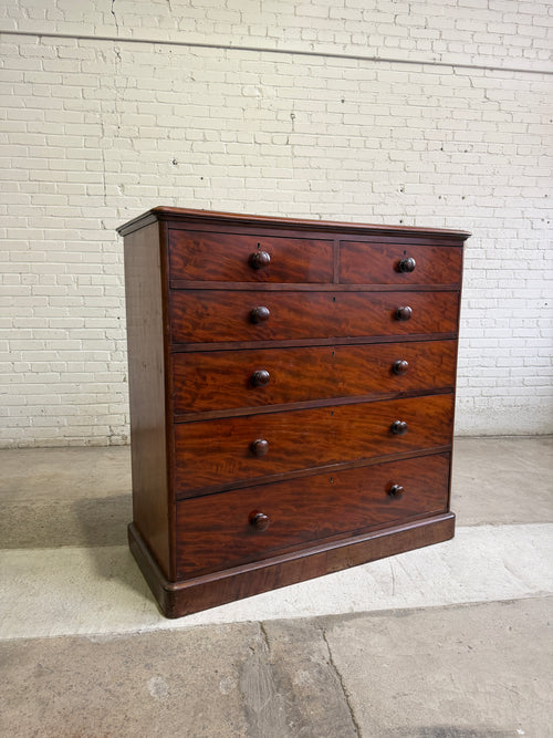 An Antique English Flame Mahogany Chest of Drawers c.1860
