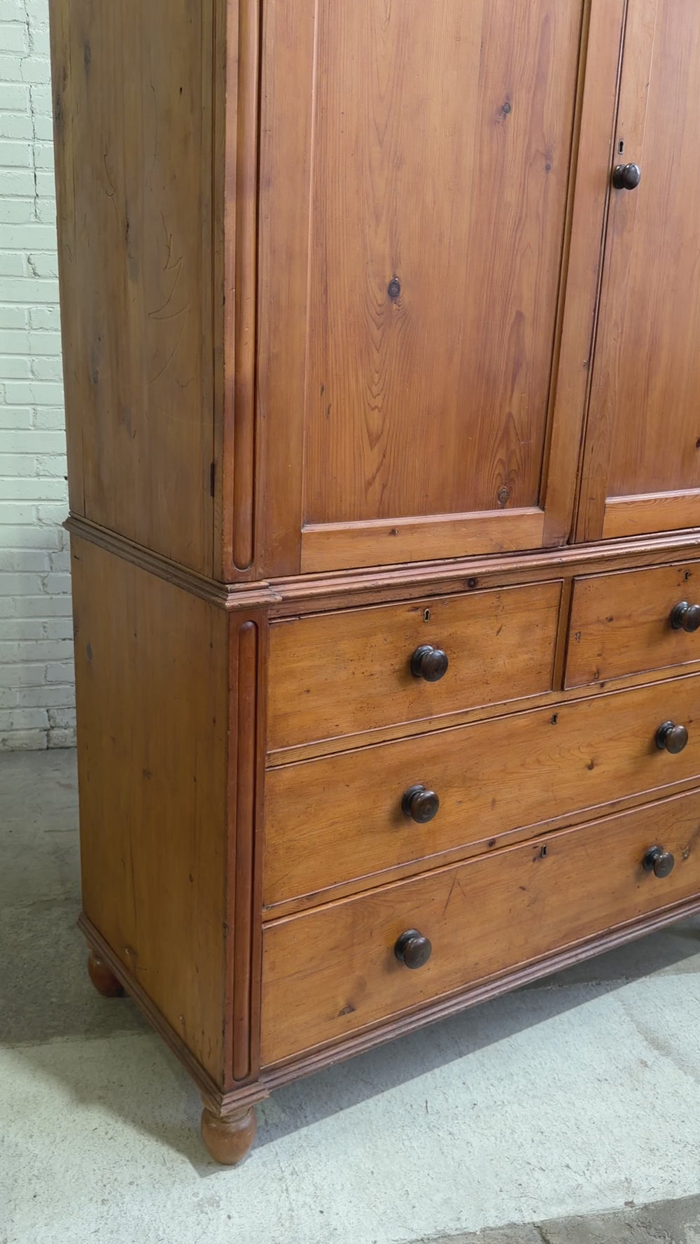 A Large English Antique Pine Linen Press with Mahogany Knobs, c. 1880
