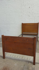 A Pair of Edwardian Heart Motif Beds by Liberty of London