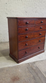 An Antique English Flame Mahogany Chest of Drawers c.1860